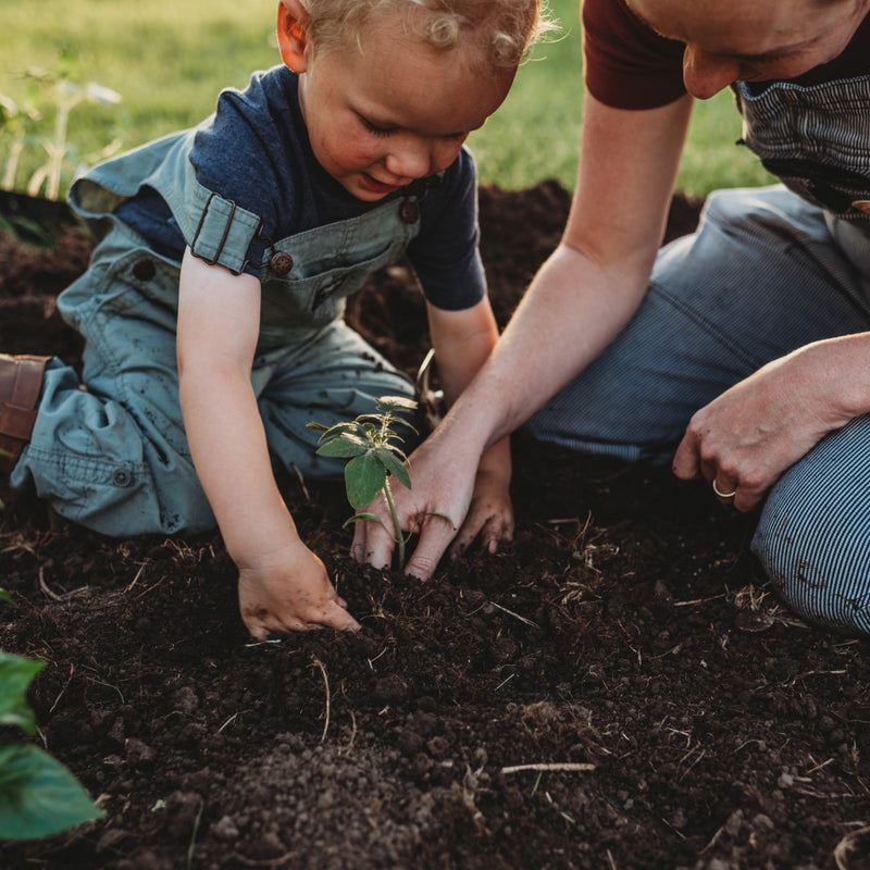 Mom and son gardening